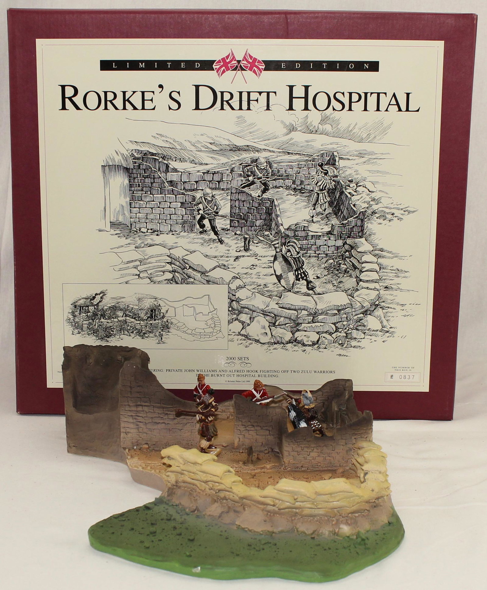 Britains Rourke's Drift Hospital: Zulu War Rourke's Drift Hospital Diorama Base Depicting the Burnt Out Hospital with Two British Figures and Two Zulu Figures. Limited Edition of 2000. Piece Measures 15 x 14 inches. 5 Pieces. Mint Sea