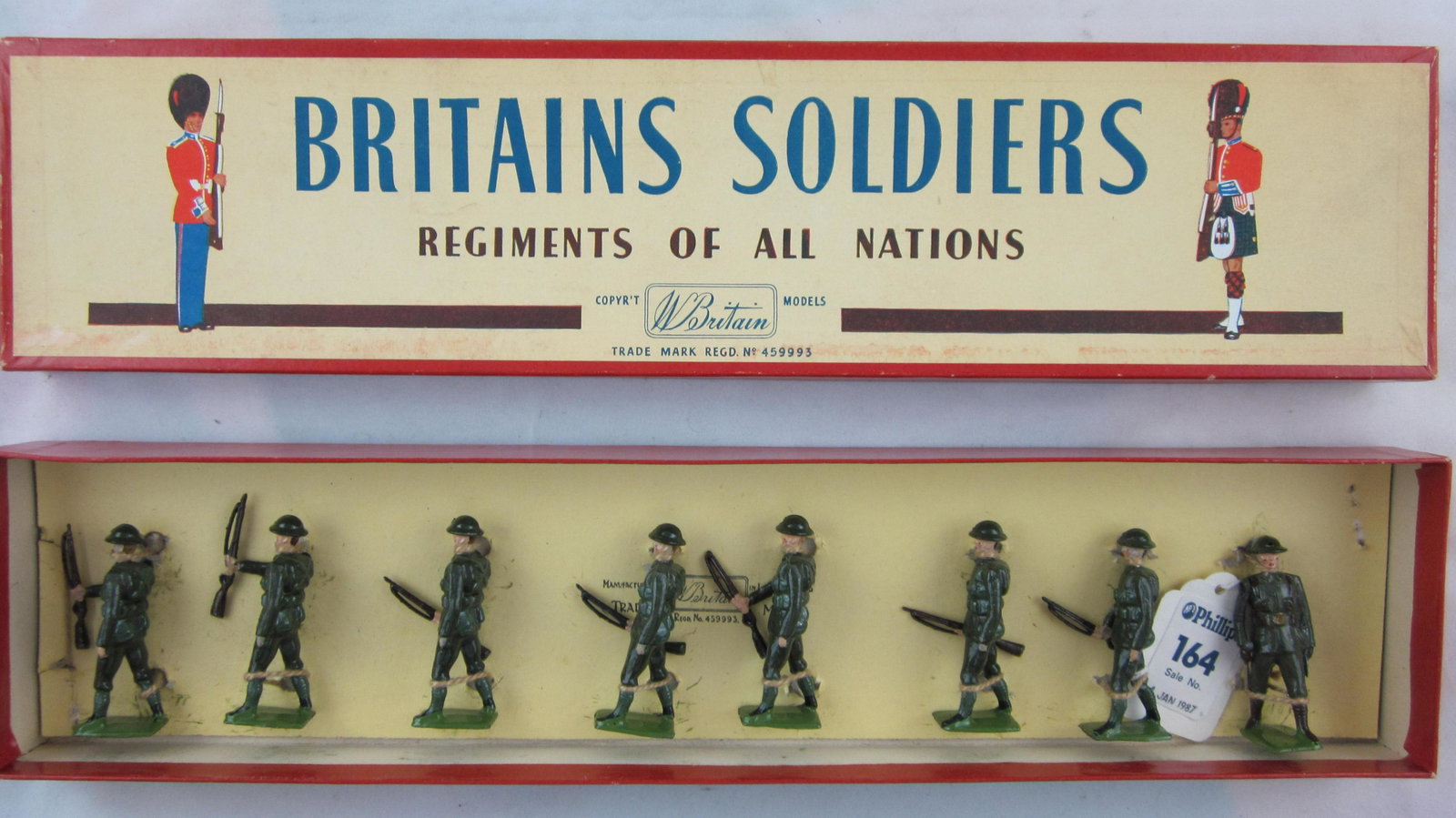 Britains Set #195 Postwar British Infantry.: Boxed British Infantry at trail without gasmasks. 8 pieces. Condition near Mint, 1 man has casting flaw to rifle tip, circa 1950. Box condition excellent, figures retied in ROAN box.
