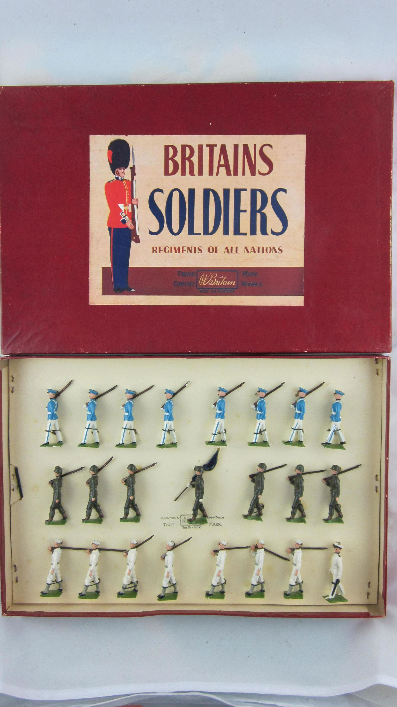 Britains Set #2100 Venezuelan Triple Row Box.: Boxed Venezuelan Infantry, Sailors & Military School Cadets along with National Standard. 23 pieces only offered 1955-1964. Condition Mint Tied in very good ROAN box with restored original lid. Rarely