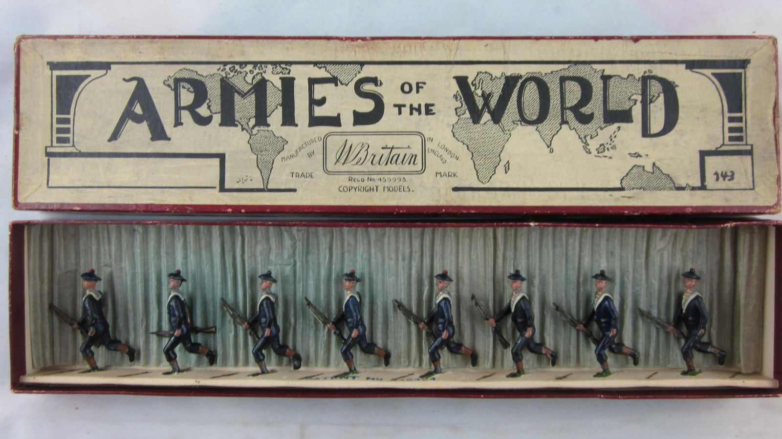 Britains Set #143 Running French Matelots.: Boxed French Matelots running at trail. 8 pieces circa 1920s (Note that Set 143 ended Pre-War issue in 1932. Condition very good (2 minute rifle tip & 1 sling casting flaws) in very good Armies of Wor