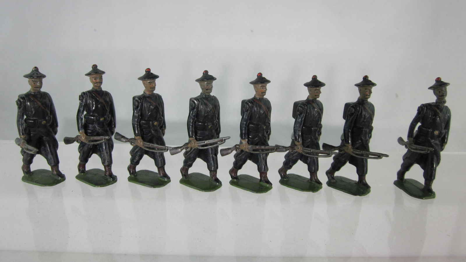 Paris Office French Matelots in Greatcoats: UNBOXED Matelots in winter coats marching at trail. From Ed Ruby Collection, French sailors in midnight blue greatcoats. Unique figures. 8 pieces. Condition excellent but 1 man head poorly reglued. No