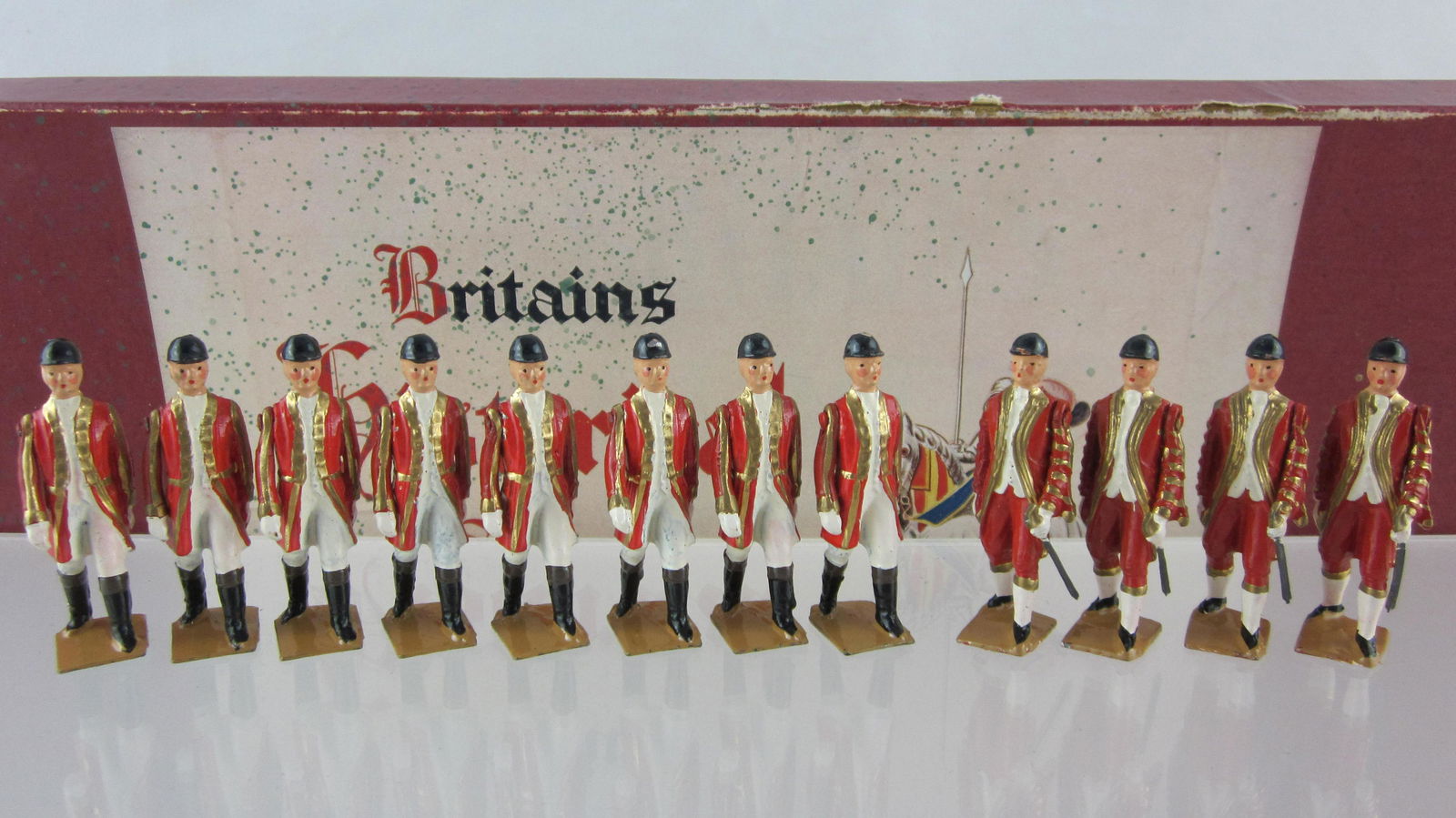 Britains Set #9404 Attendants For State Coach.: Boxed State Coach Attendants, 8 Outriders, only 4 of 6 Footmen, & NO Yeomen. 14 pieces circa 1955. Condition excellent in very good Historical Series label box, some paint overspray on label.