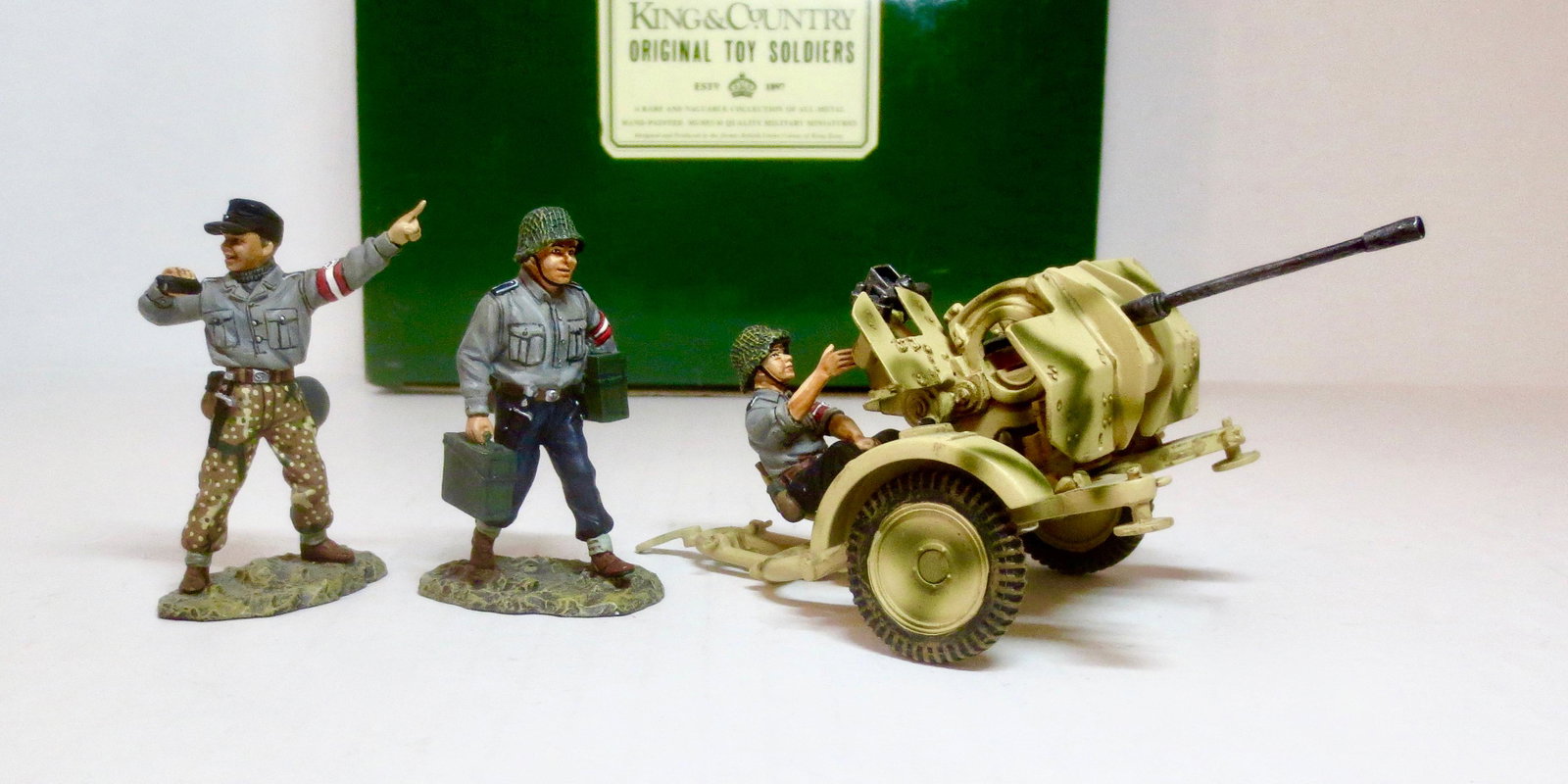King & Country #WS033 Anti Aircraft Gun and Crew: Three young Hitler Jugend Volunteers man a small, wheeled 20mm FLAK GUN. 4 pieces. Retired set. Near mint in box. Box excellent.