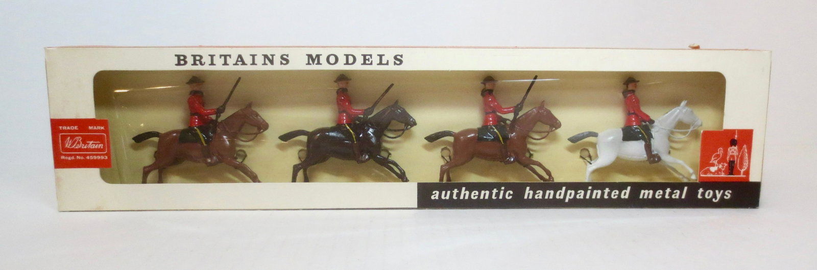 Britains #9256 Royal Canadian Mounted Police: Post war issue. 4 pieces. Mint condition, tied to card In original cellophane fronted box. Box very good, cellophane beginning to come loose.
