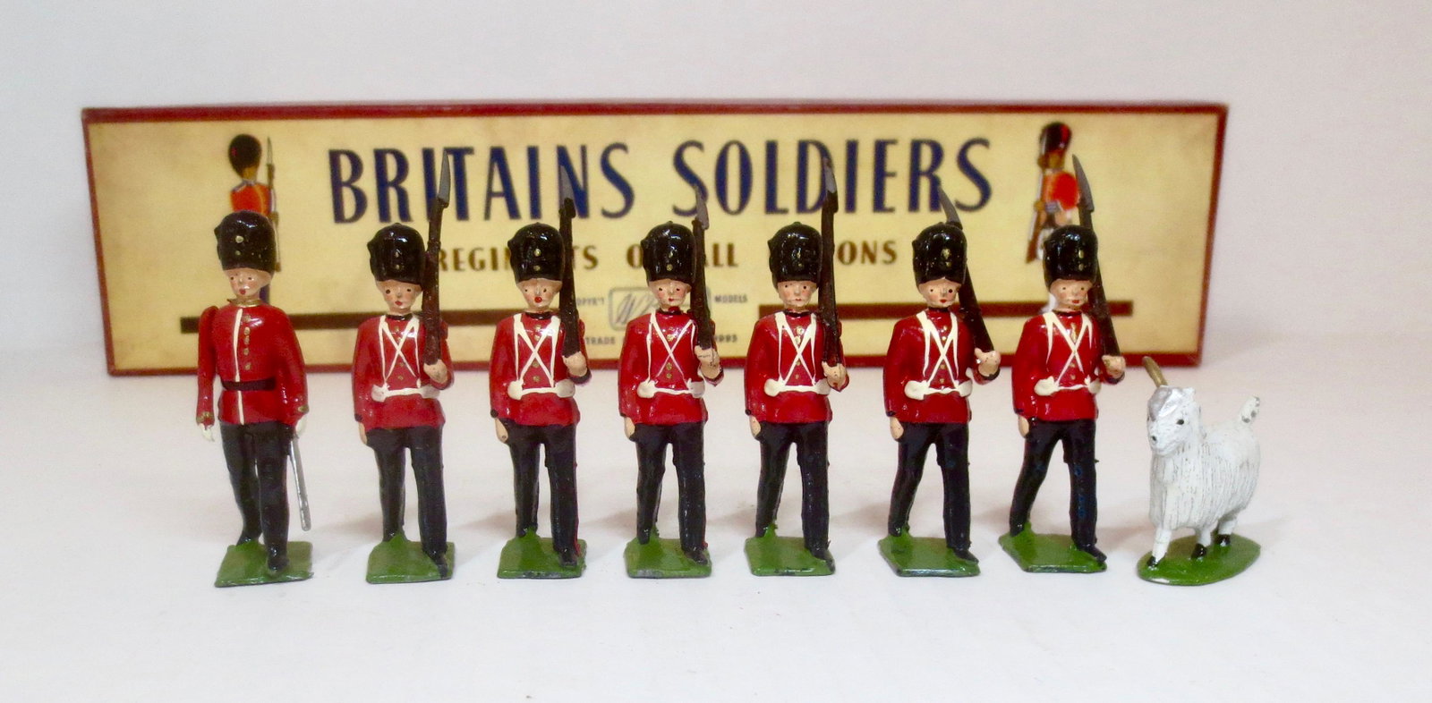 Britains #74 Welsh Fusiliers with Mascot: Post War, circa 1959. 8 pieces. Excellent to good condition (goat mascot missing one horn), with original ROAN box. Box excellent.