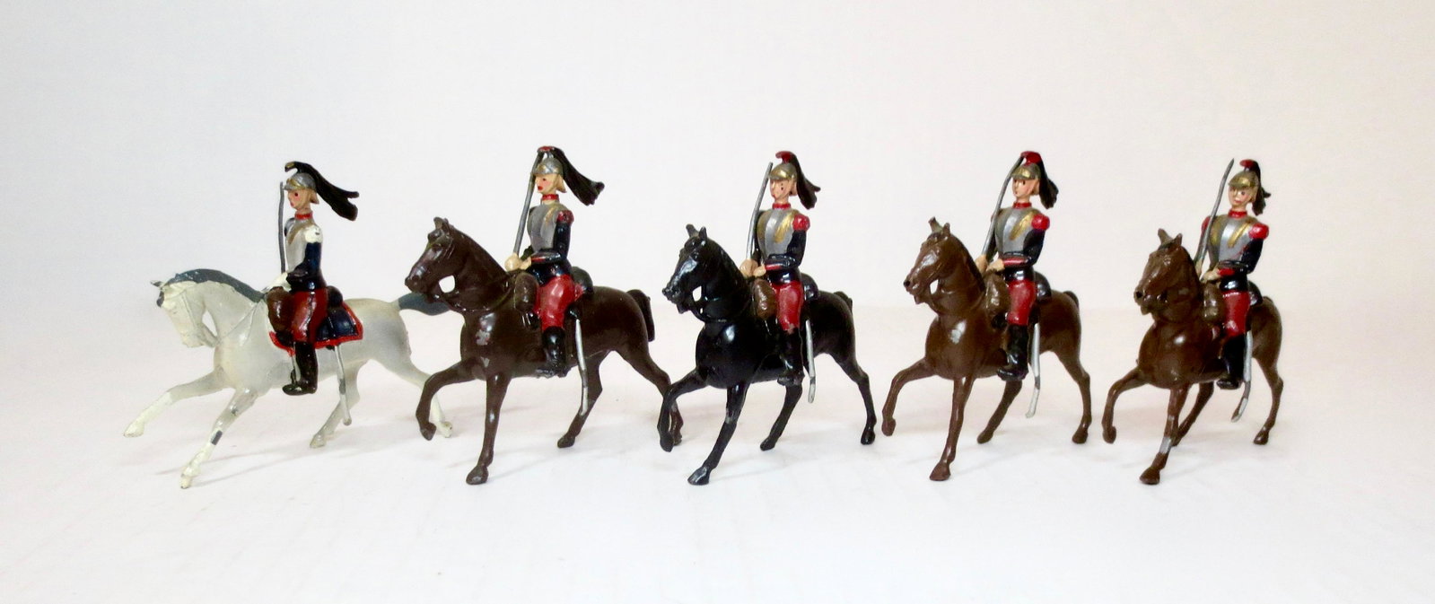 Britains #138 Cuirassiers: Post war issue. 5 pieces. Very good to good condition, with some paint loss. Unboxed.
