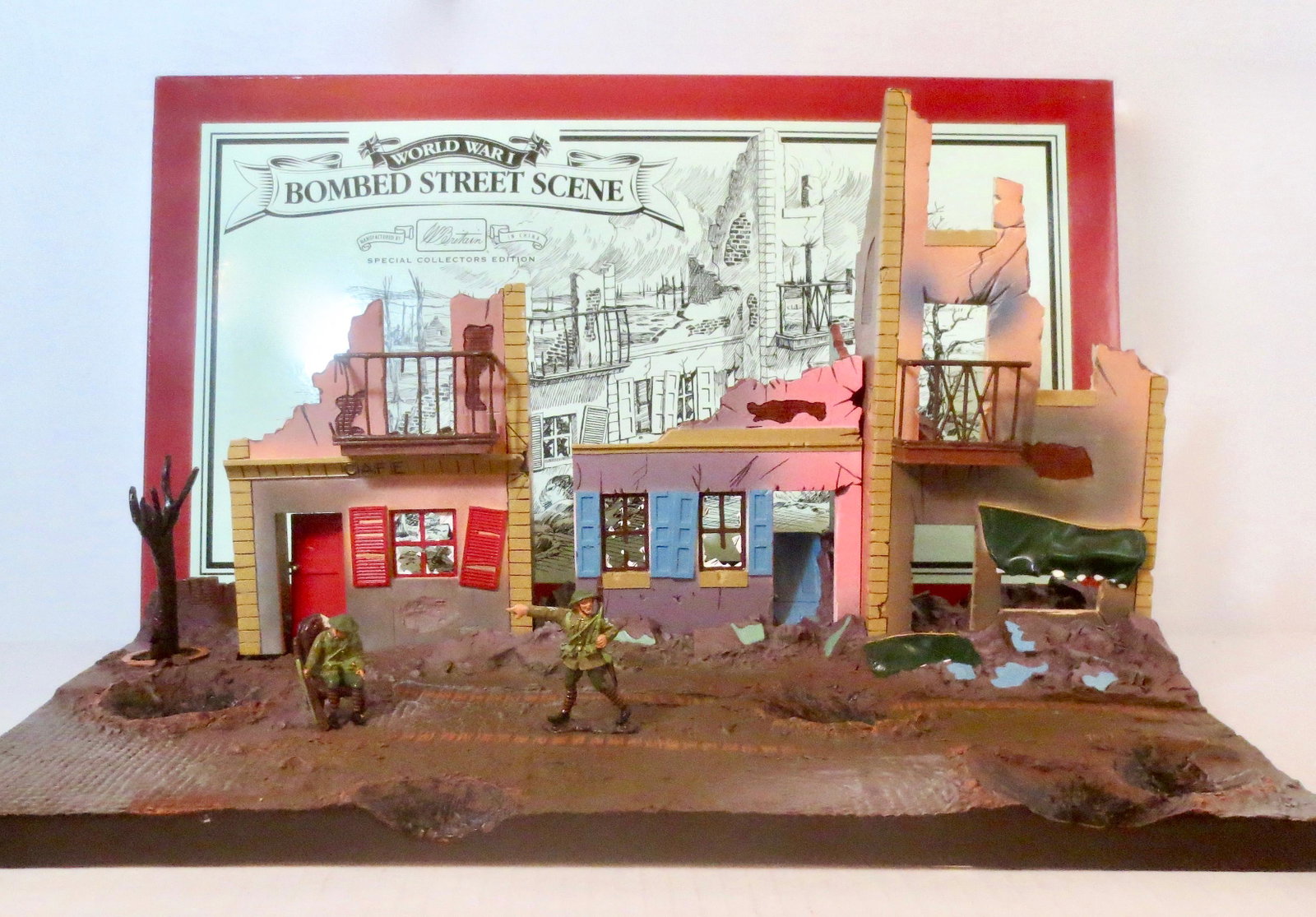 Britains #00159 Bombed Street Scene: World War I Bombed Street Scene. 7 pieces. Excellent condition. Box good. *Additional shipping cost to be determined due to large lot size*