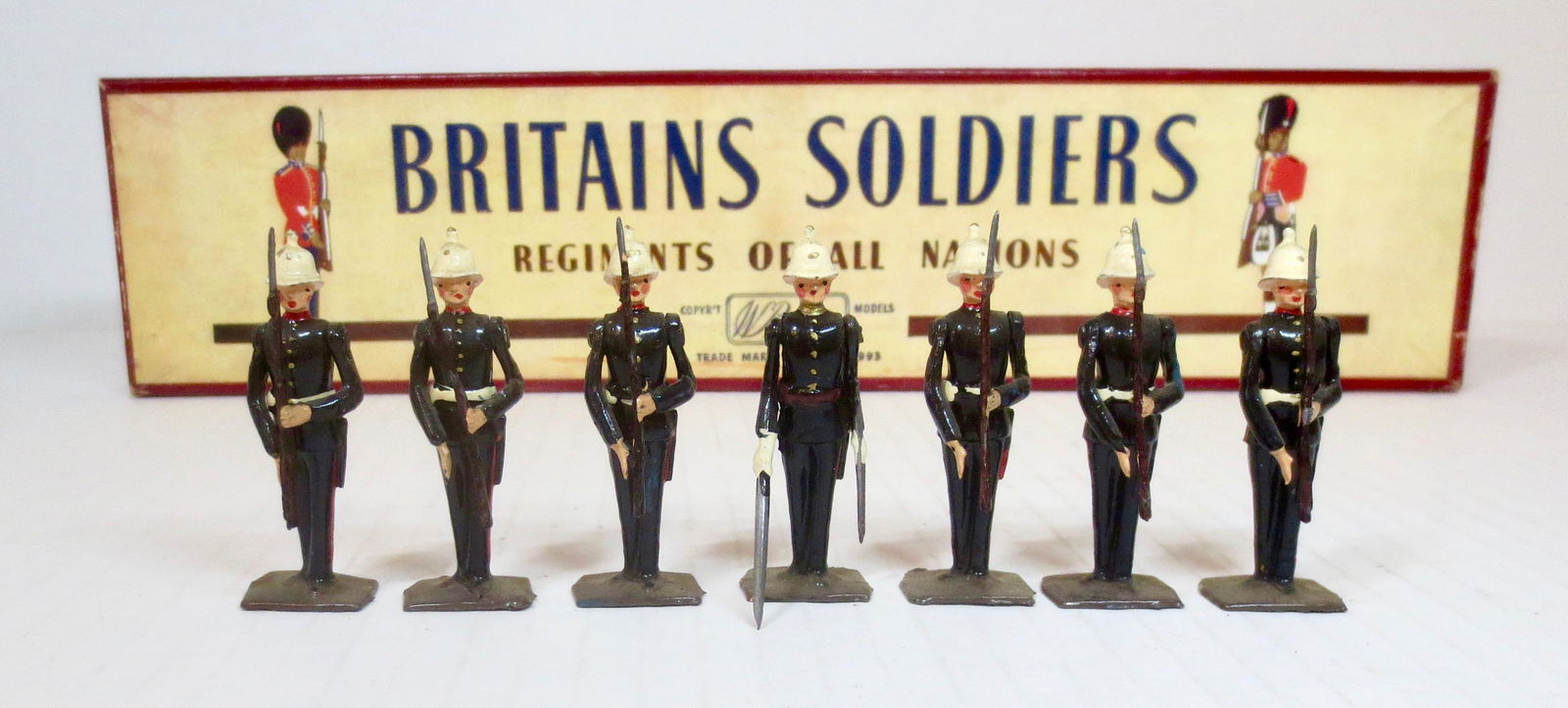 Britains #2071 Royal Marines: Present Arms. Post war issue, with original ROAN box. 7 pieces. Excellent condition. Box excellent.