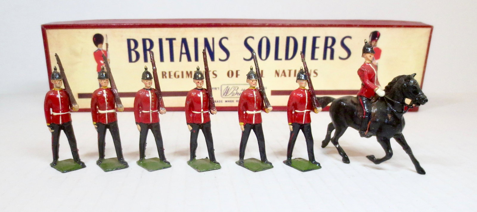 Britains #36 The Royal Sussex Regiment: Marching at slope with Mounted Officer. Post war issue, with ROAN box. 7 pieces. Excellent condition. Box excellent.