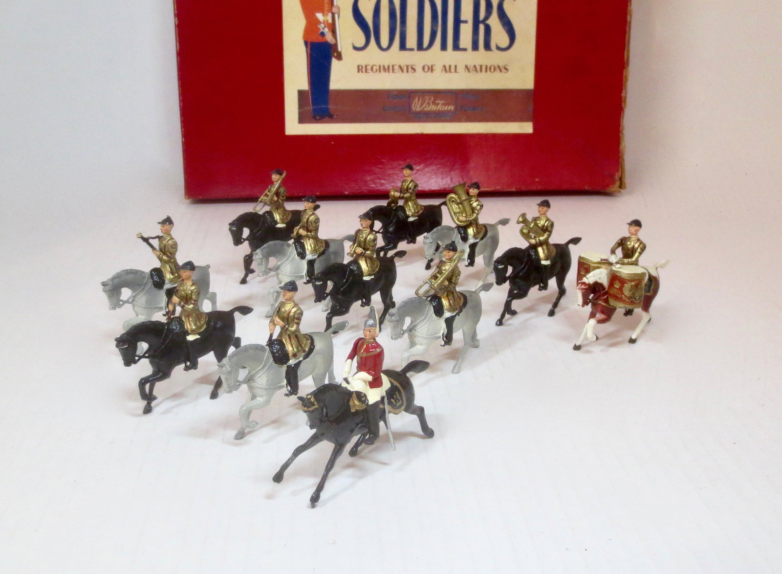 Britains #101 The Band of The Life Guards: Post war issue, with original ROAN box. 12 pieces. Excellent condition. Box very good with edge wear, and fading on the top.
