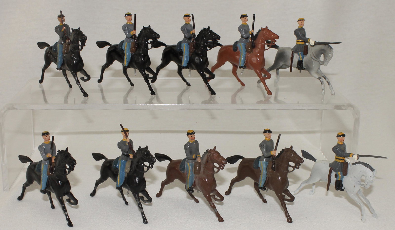 Britains Lot ACW Confederate Cavalry: American Civil War. Confederate Cavalry. Lot includes 2 sets of Set #2055. Circa 1951-1959. 10 Pieces. Condition Good. Both Sets Mismatched Paint. One Trooper Missing Rifle. No Box.
