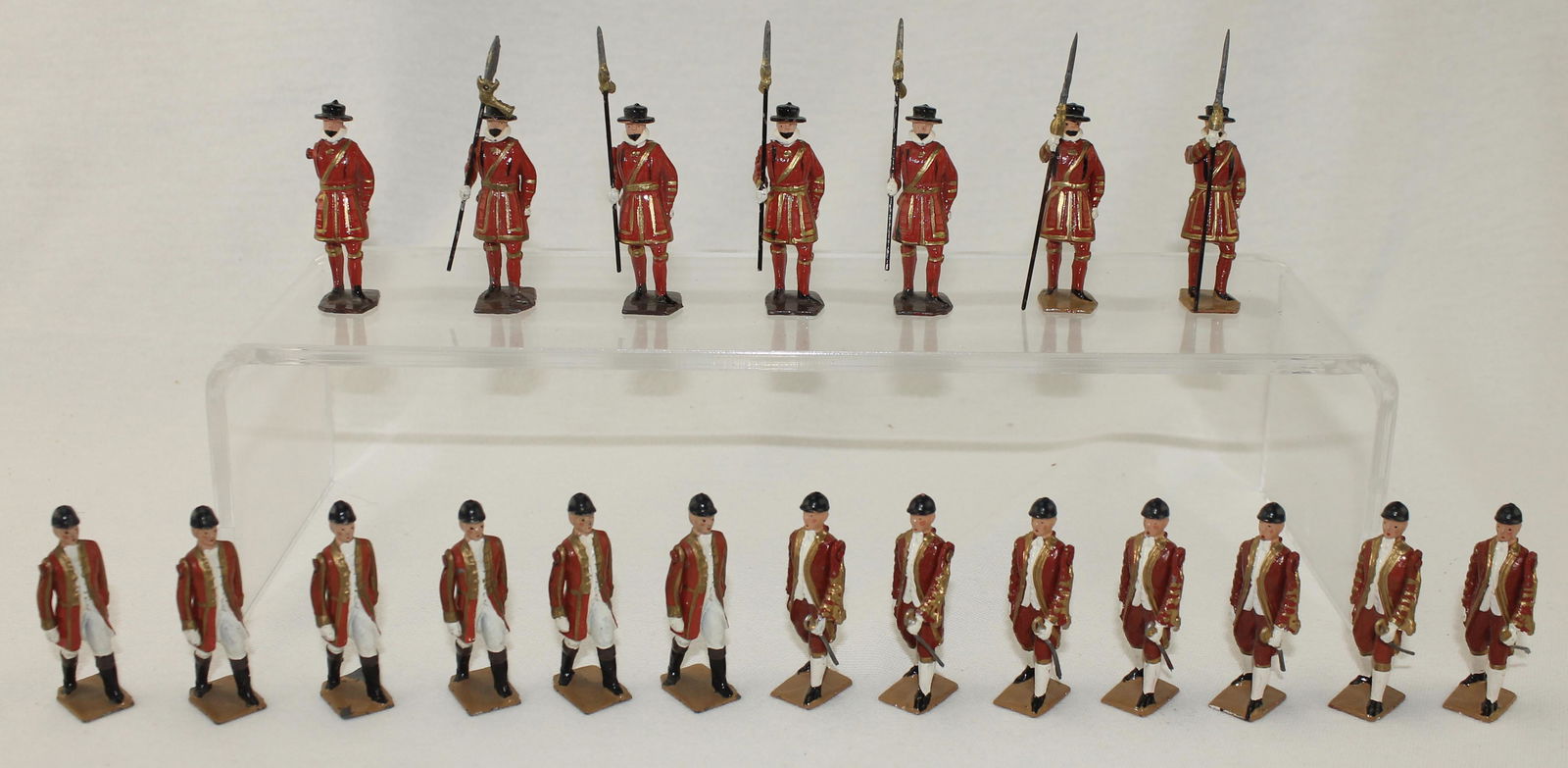 Britains Lot State Coach Attendants: Historical Series. State Coach Attendants. Lot includes 6 Walking Outriders on Foot and 7 Yeomanry with Pikes from Set #1475. Circa 1952-65. 20 Pieces. Condition Good to Very Good. One Arm Missing. No