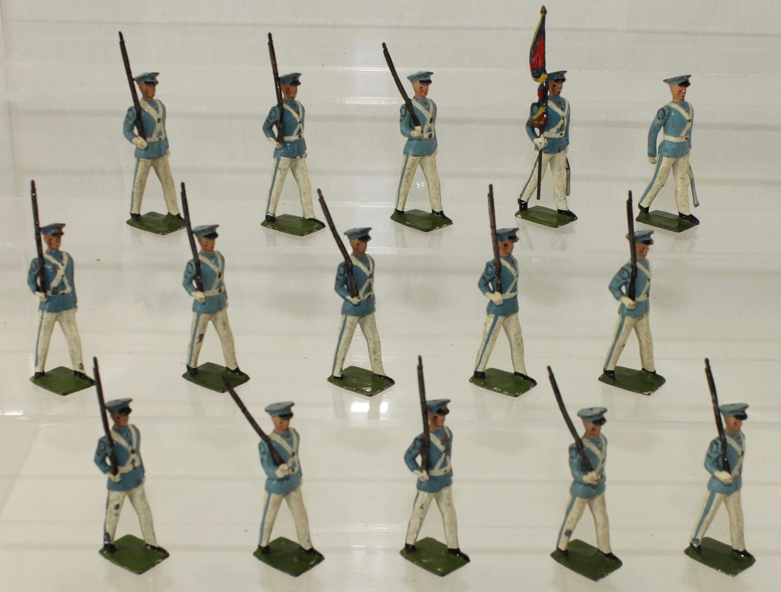 Britains Set #2105 Venezuelan Infantry: Venezuelan Infantry with National Standard. Made 1955-59. 15 Pieces. Condition Good. Flag Bearer Arm Loose. Slight Mismatched Paint. No Box.