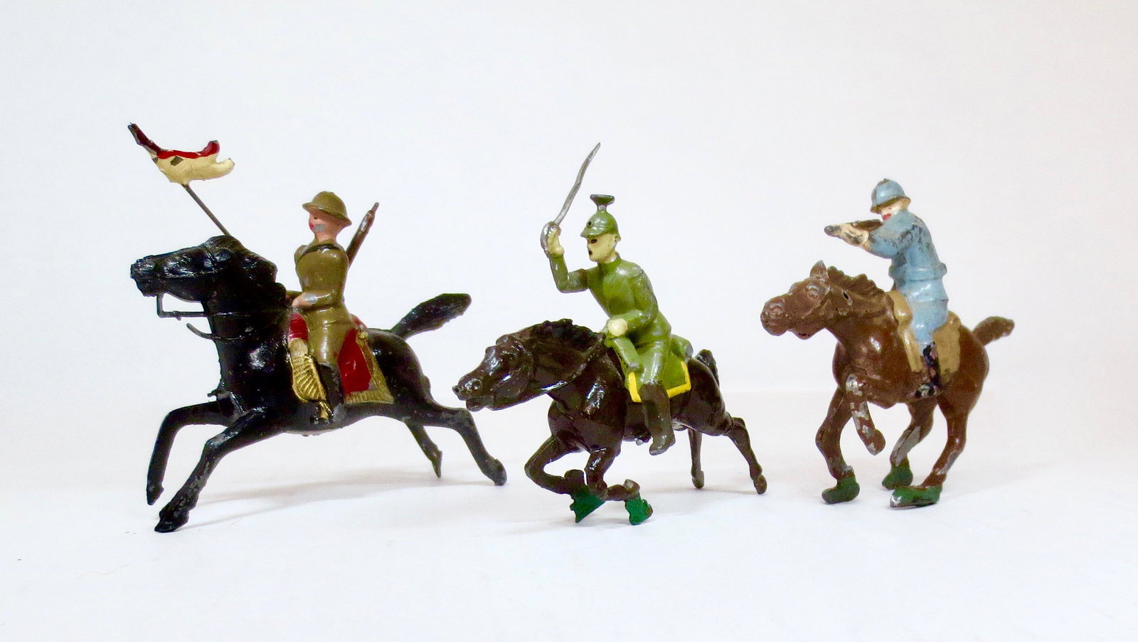 French Hollowcast Mounted Figures: Includes a Mounted Officer charging with drawn sword, and Mounted Rifleman firing from B.F (missing tip of rifle)., and a British Lancer from G.M. (missing lance tip). Very good to good condition. Unb