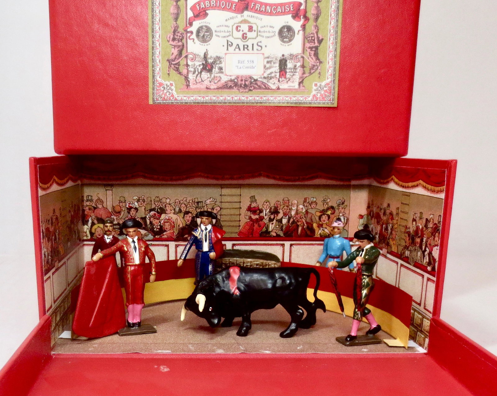 Mignot #558 "La Corrida" Diorama: Spanish Bullfight set; including three Toreadors, lady and gentleman audience members, ring fencing, and Bull. 9 pieces. Excellent condition. Box excellent.