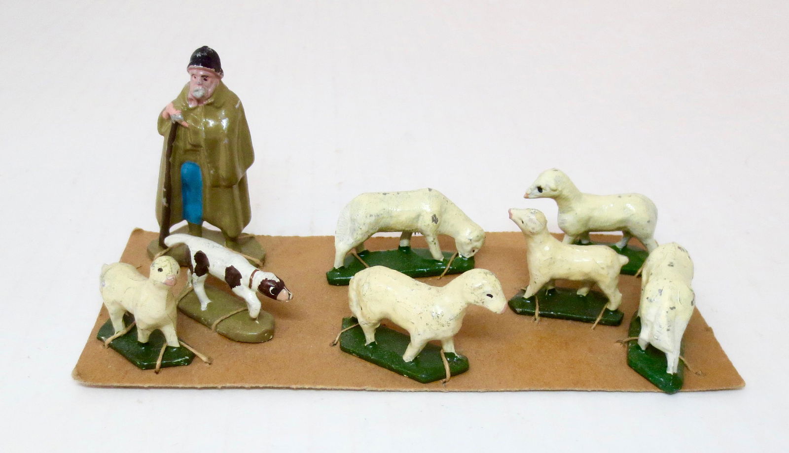 CBG Shepherd and Flock Set: Includes; Shepherd, Dog, and Sheep. 8 pieces. Mint to near mint condition. Tied to card. Unboxed.