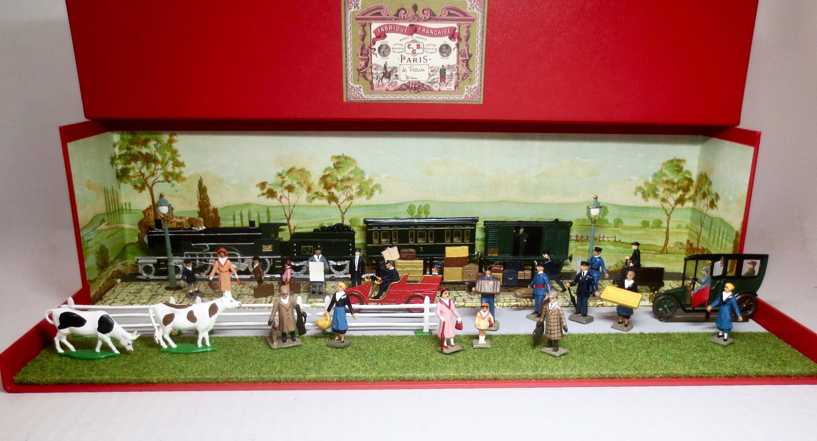 Mignot le Train Diorama: Expansive train station set includes; Train engine & cars, automobiles, porters, farm figures, passengers & accessories. 34 pieces. Near mint condition. Box excellent. Shipping cost to be determined d