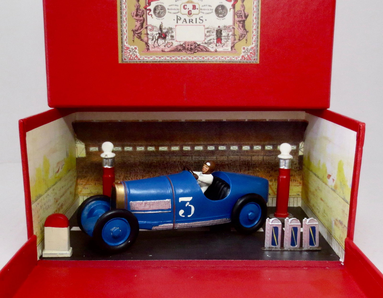 Mignot Race Car Diorama: Scenic box set. Includes race car, driver and accessories. 6 pieces. Near mint condition. Box excellent.