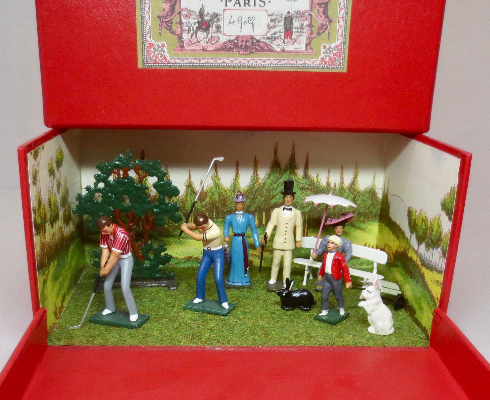 Mignot "le Golf" Diorama: Scenic boxed set. Includes golfers, caddy, spectator, rabbits and tree. Near mint condition. Box excellent.