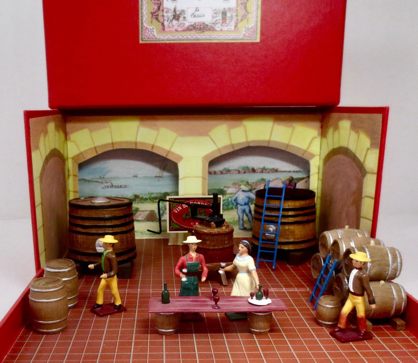 Mignot "le Chais" Diorama: The wine cellar scenic set. Includes vineyard workers, wine taster, barrels and accessories. 16 pieces. Near mint condition. Box excellent.