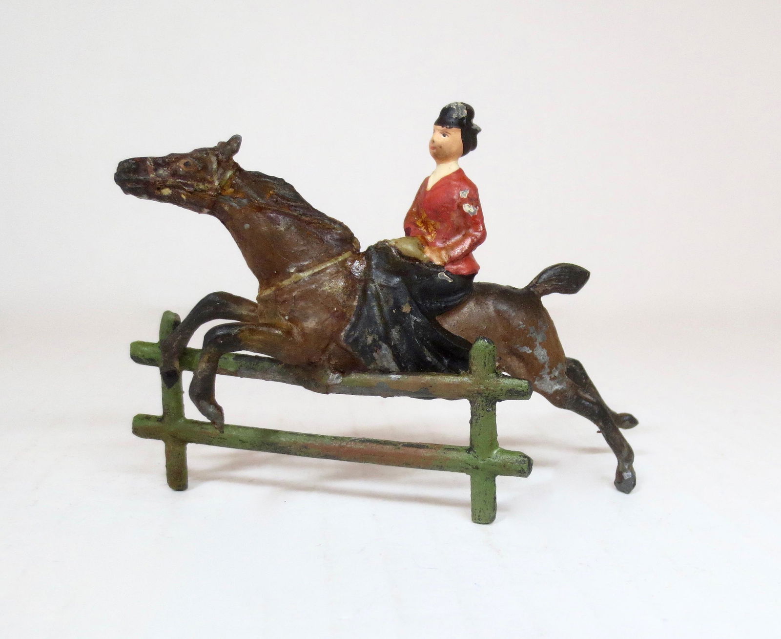 Heyde 60mm Huntswoman Jumping Fence: Pre war. 60mm scale. Circa 1930. 1 piece. Excellent condition. Unboxed