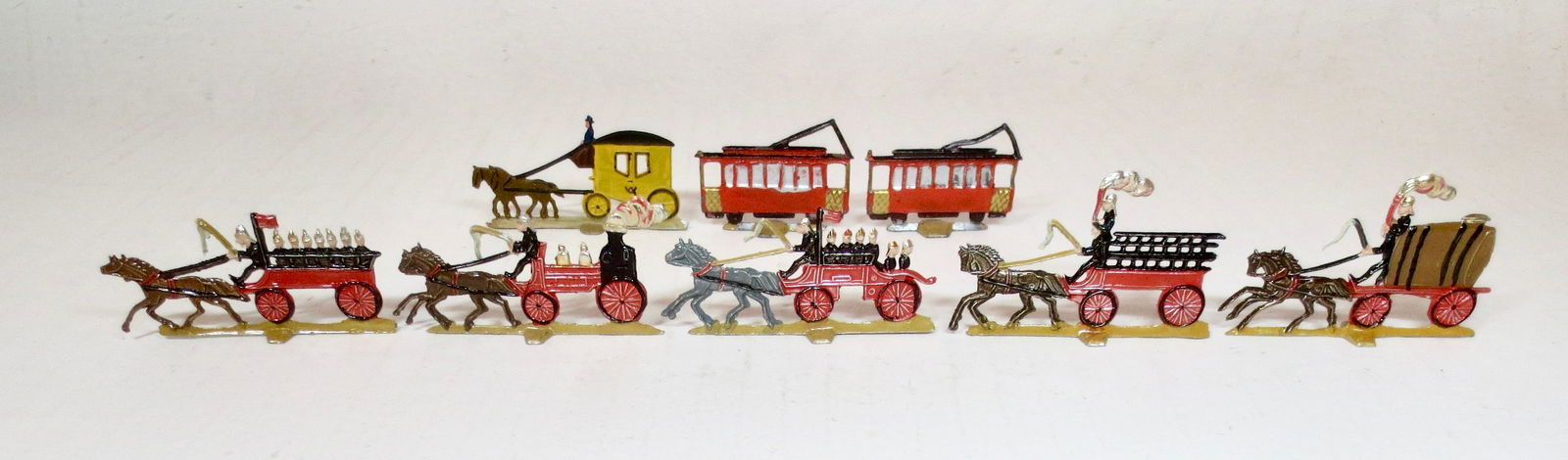 Mignot Small Scale Fire Brigade Flats: Post war issue. Includes Horse Drawn Coach, Street Cars, and Fire Brigade. 1-1/2" to 2-1/2" long. 8 pieces. Excellent condition. Unboxed.
