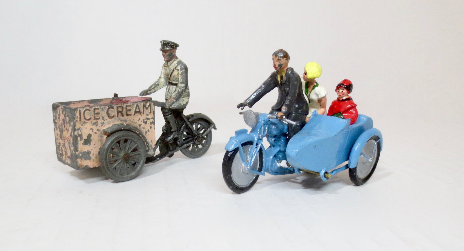 Morestone & Britains Civilians: Morestone Ice Cream Man on Bicycle, and Britains Motorcycle with Side Car. 5 pieces. Good condition (Britains Motorcycle and Passengers are recasts, driver is original). Unboxed.