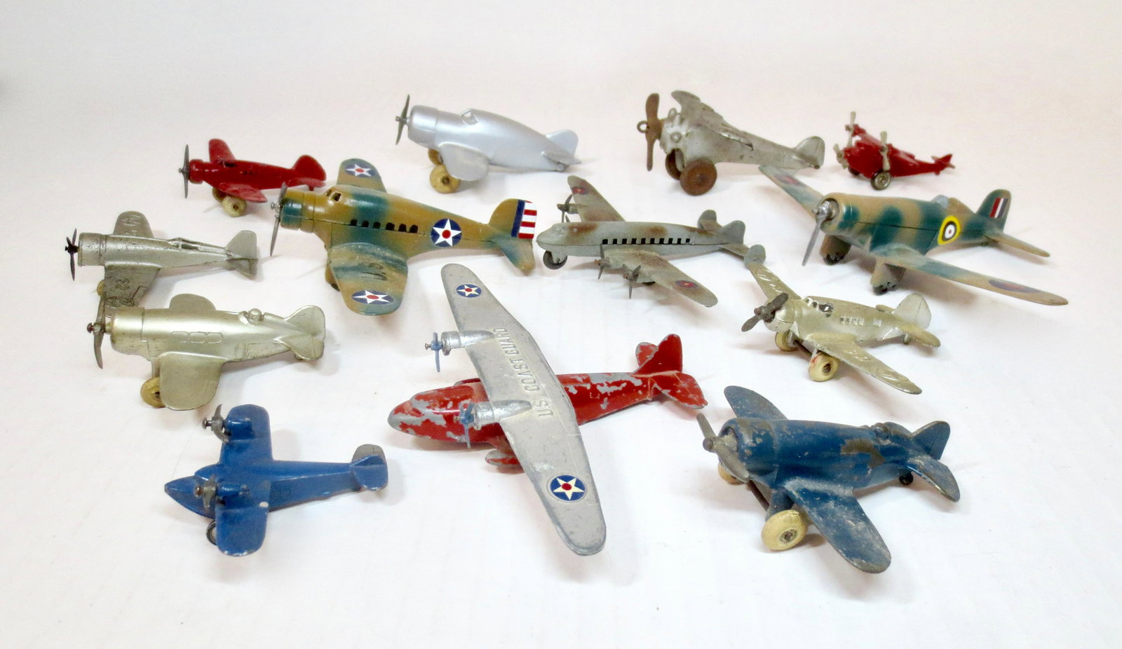Assorted Diecast Toy Airplanes: Includes examples from Erie, Barclay, Tootsietoy and more. 13 pieces. Excellent to very good condition (one broken propeller, and one repainted plane). Unboxed.