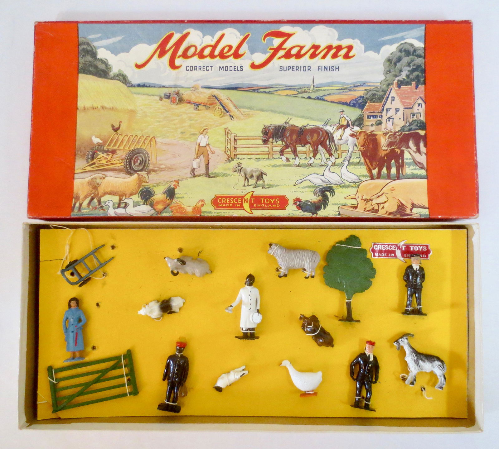 Crescent Farm and Rail Display Set: Scarce set. Includes Passenger, Station Master, Pullman Waiter and Porters, and Farm animals. Mint to near mint condition, tied to card in box (three loose figures). Illustrated box excellent.