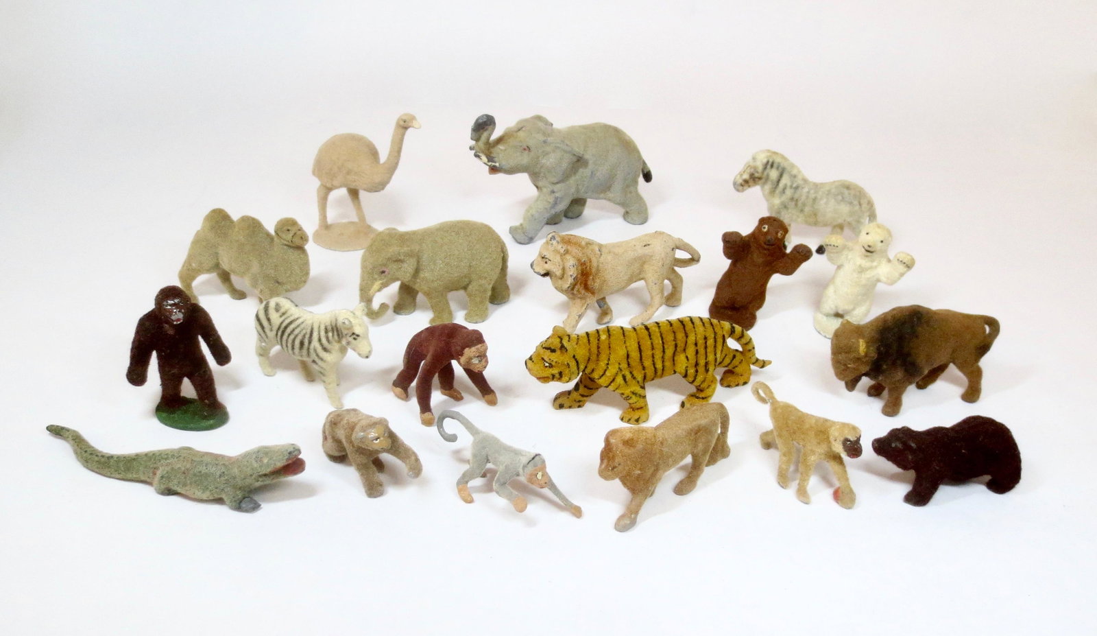 Flocked Zoo Figure Assortment: Fine array of figures from Timpo and other makers. 19 pieces. Near mint to excellent condition.