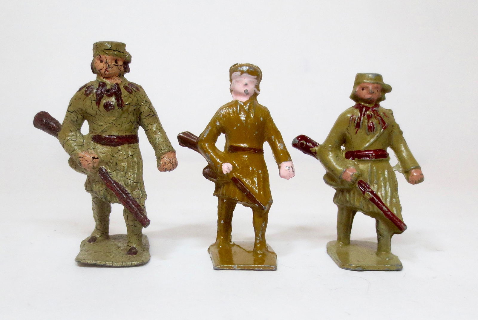 Lincoln Logs American Pioneer Versions: Three sizes including the Rare 58mm figure. Excellent to very good condition. Paint crackling on the largest figure. Unboxed.