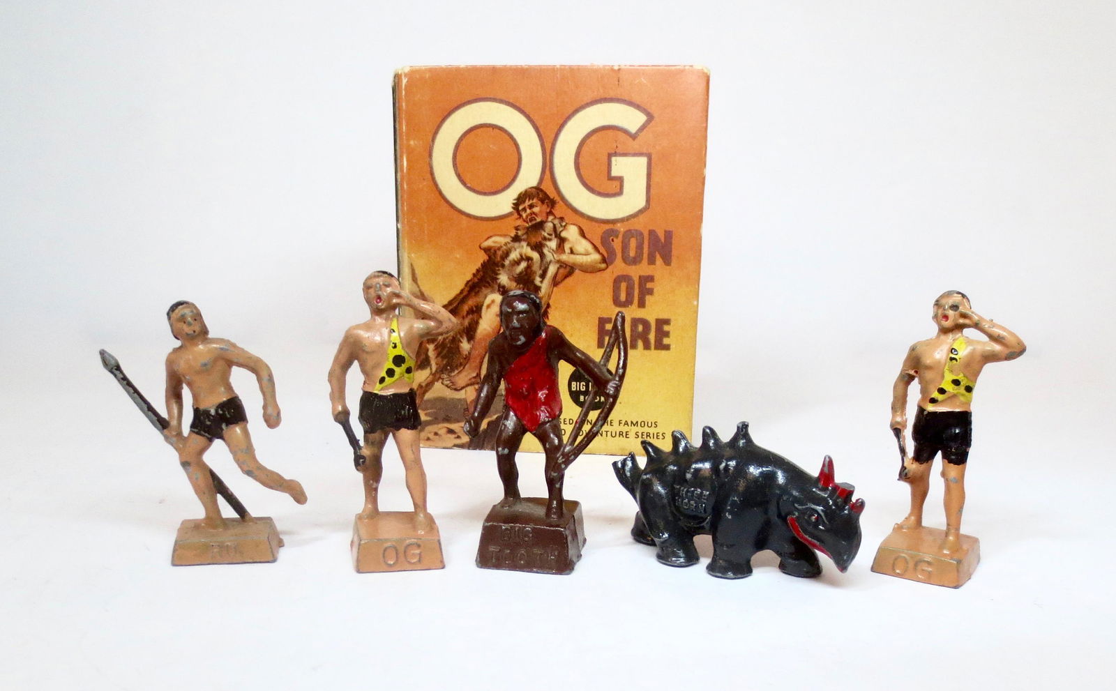 Lincoln Logs "OG SON OF FIRE" Assortment: OG, RU, BIG TOOTH, THREE HORN and the original "OG, Son of Fire" book. Excellent to very good condition (Three Horn is missing the tip of his tail). Unboxed.