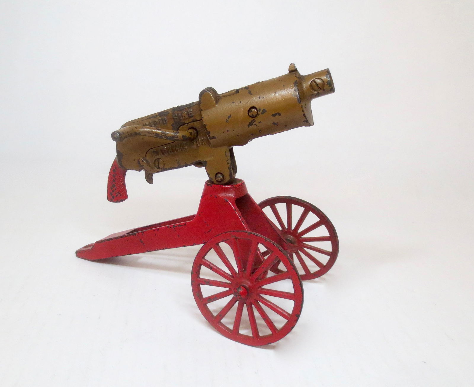 VERY RARE Grey Iron 9" Rapid Fire Machine Gun: Scarce Cast Iron Cap Gun circa 1920's. In excellent working condition. Measures 9" long on it's wheeled base. Unboxed.