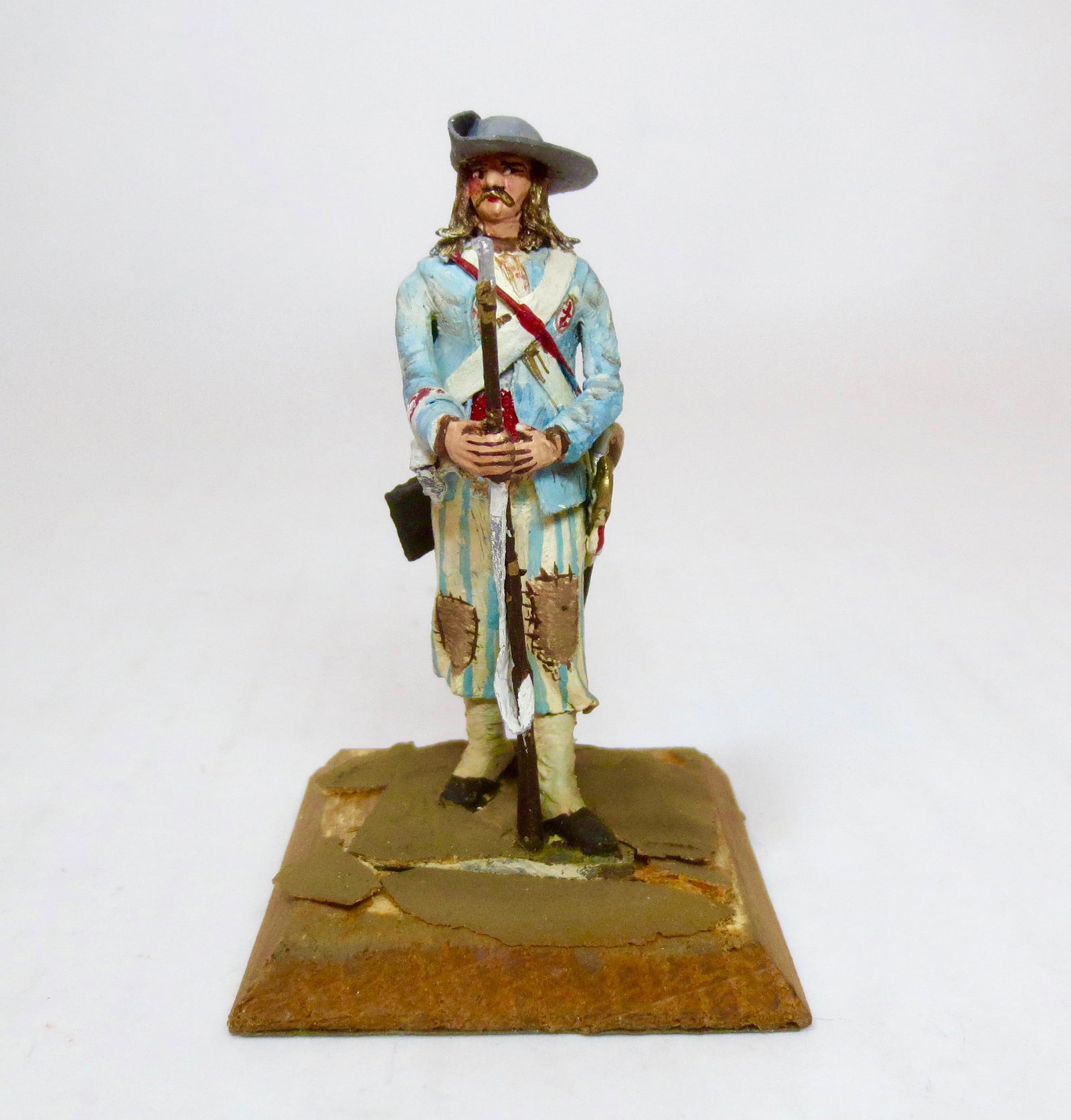 Bernard Vanot "French Militia": Highly detailed and colorfully painted militia man with rifle. Good condition. Landscaped base is chipped. Minor paint wear. Unsigned.