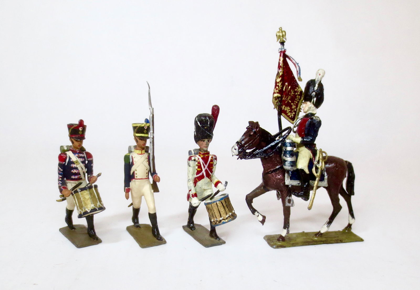 Lucotte Assorted Figures: Mounted Flag Bearer, Drummers and Private on the march. 4 pieces. Excellent condition with some minor paint wear.