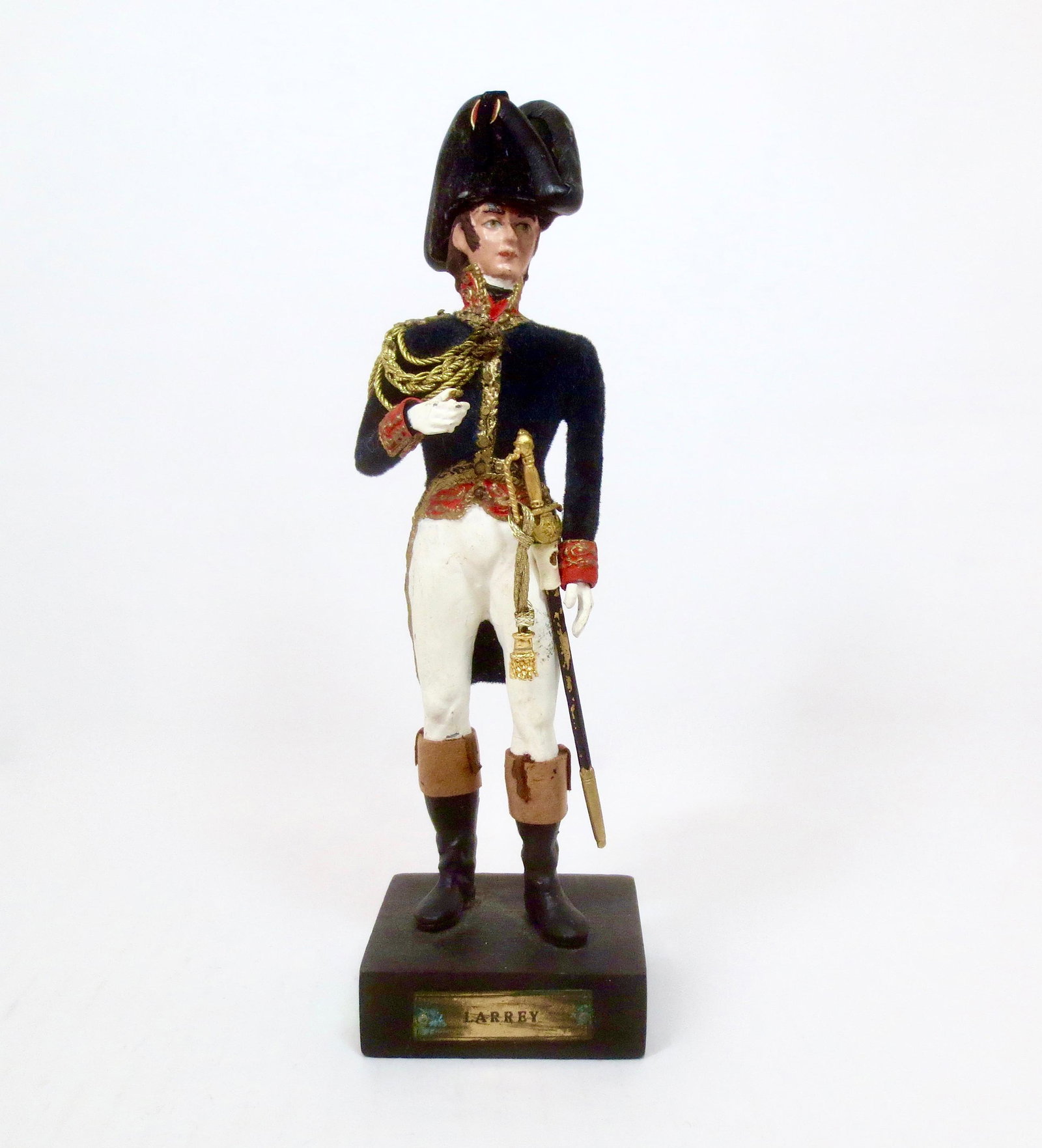 Marcel Riffet Large Scale "Baron Larrey": Napoleon's Surgeon. Superb figure hand crafted and signed on the bottom. Flocked uniform and hat, hand decorated with actual material including gold cording. 8" tall to the top of his hat. Heavy figur