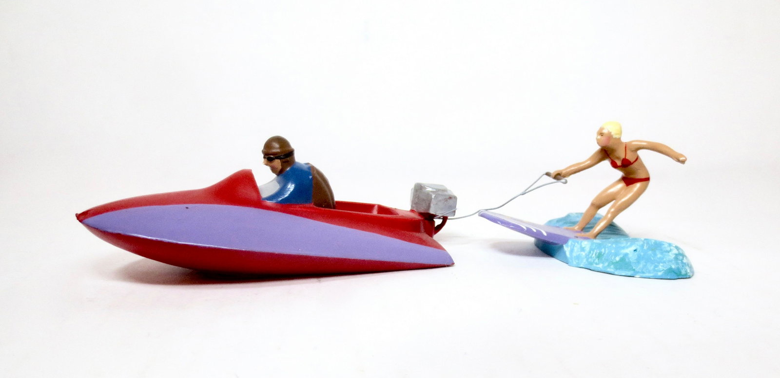 Mignot Water Skiing Set: Whimsical motor boat pulling a woman skier. 2 pieces. Excellent condition. Unboxed.