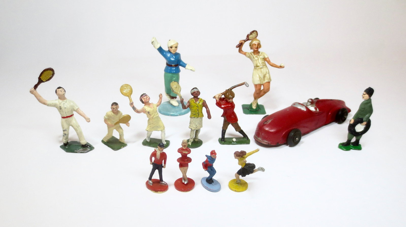 Sports Figure Assortment: Wide variety of Sports and Makers including; Hubley, Johillco, Auburn Rubber, and more. 13 pieces. Excellent condition. Unboxed.