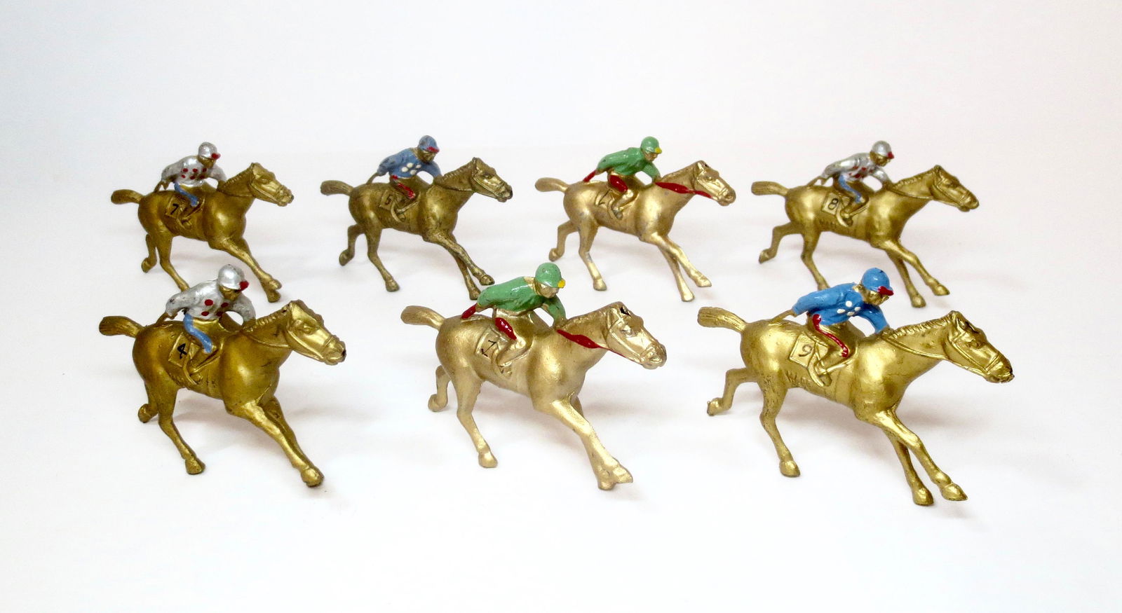 Barclay Race Horses: Mounted Jockeys on horses with numbered saddle cloths. 7 pieces. Excellent condition. Unboxed.