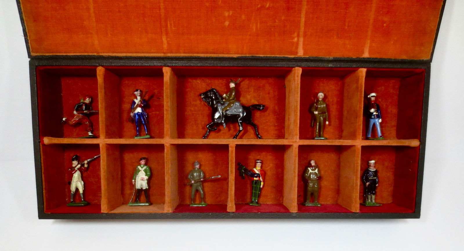 Jones Salesman Sample Case & Figures: Leather-bound case used by salesmen to promote Jones Metal Miniature figures to retailers. 11 pieces. Excellent condition. Case also excellent.