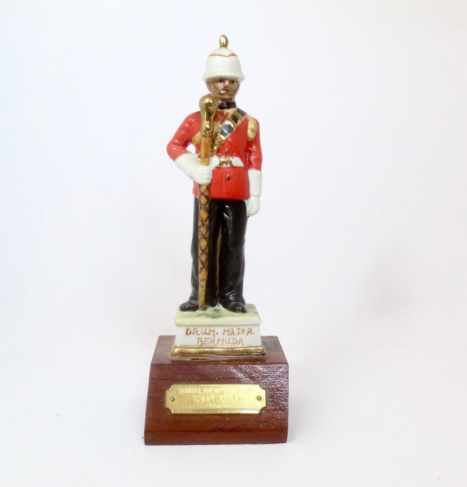 Bermuda Toy Soldier Society Trophy: "Tommy-Award" 1983 Trophy. 10-1/2" tall. Ceramic on wood plinth. Excellent condition. Unboxed.