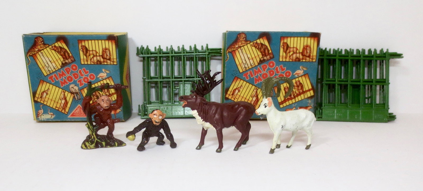 Timpo Model Zoo Sets: Includes Zoo Monkeys with Cage and Stag & Mountain Goat with Cage. 4 pieces, plus cages. Near mint condition. Illustrated boxes, excellent.