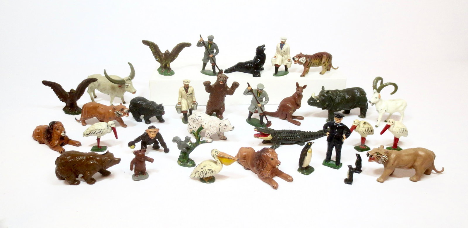 Timpo Model Zoo Assortment: Wonderful array of animals, with five very busy Zoo Keepers. 32 pieces. Near mint to excellent condition. Unboxed.