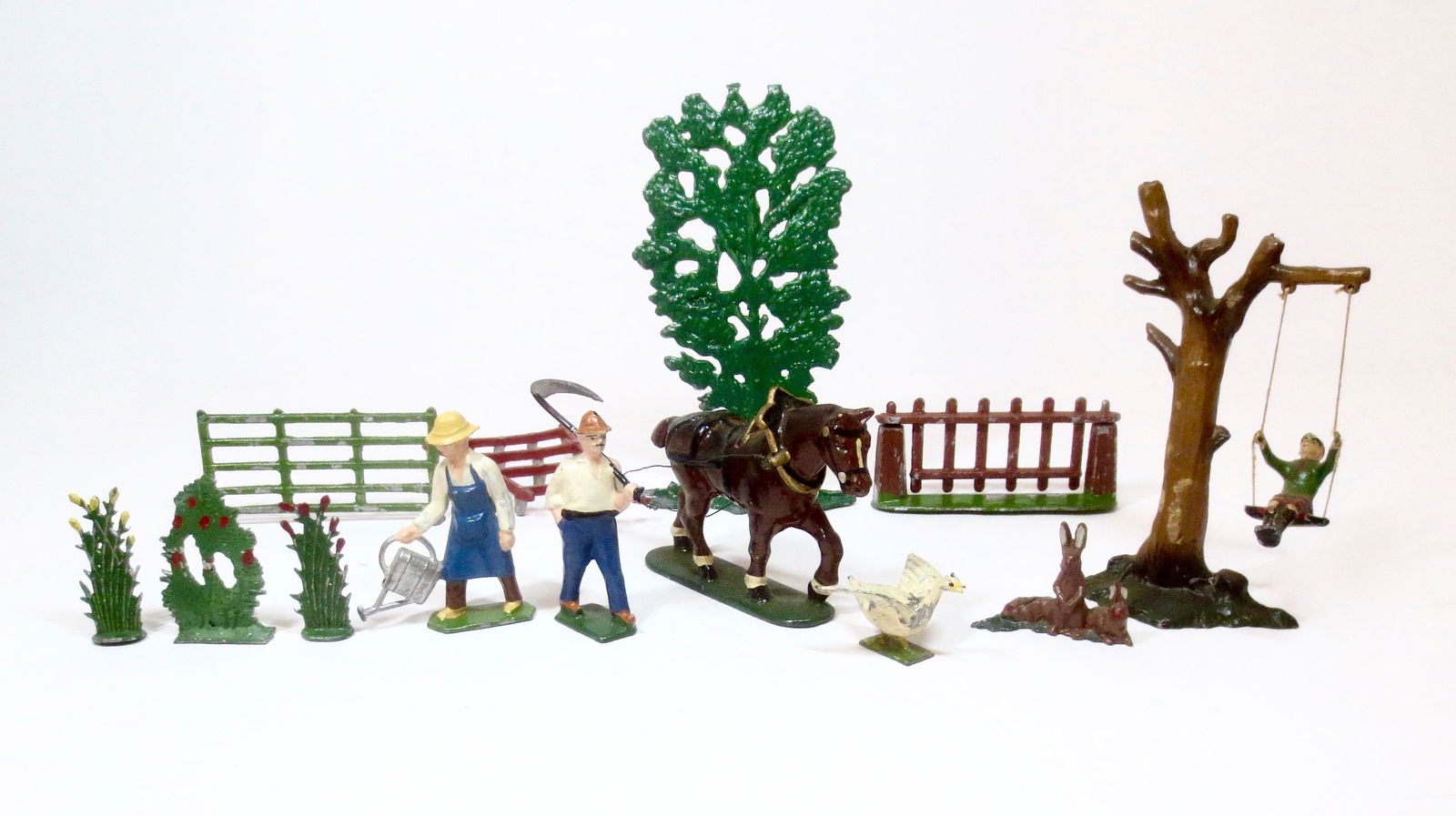French Makers Farm & Garden Assortment: Farmer with Horse pulling Plow, Gardener watering the flowers, Boy on a swing and more. 13 pieces. Excellent condition.
