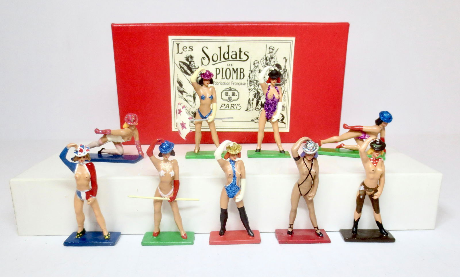 Mignot Crazy Horse Dancing Girls in Bowler Hats: Spectacular figures. 9 pieces. Near mint condition. Come with a plain Mignot box.