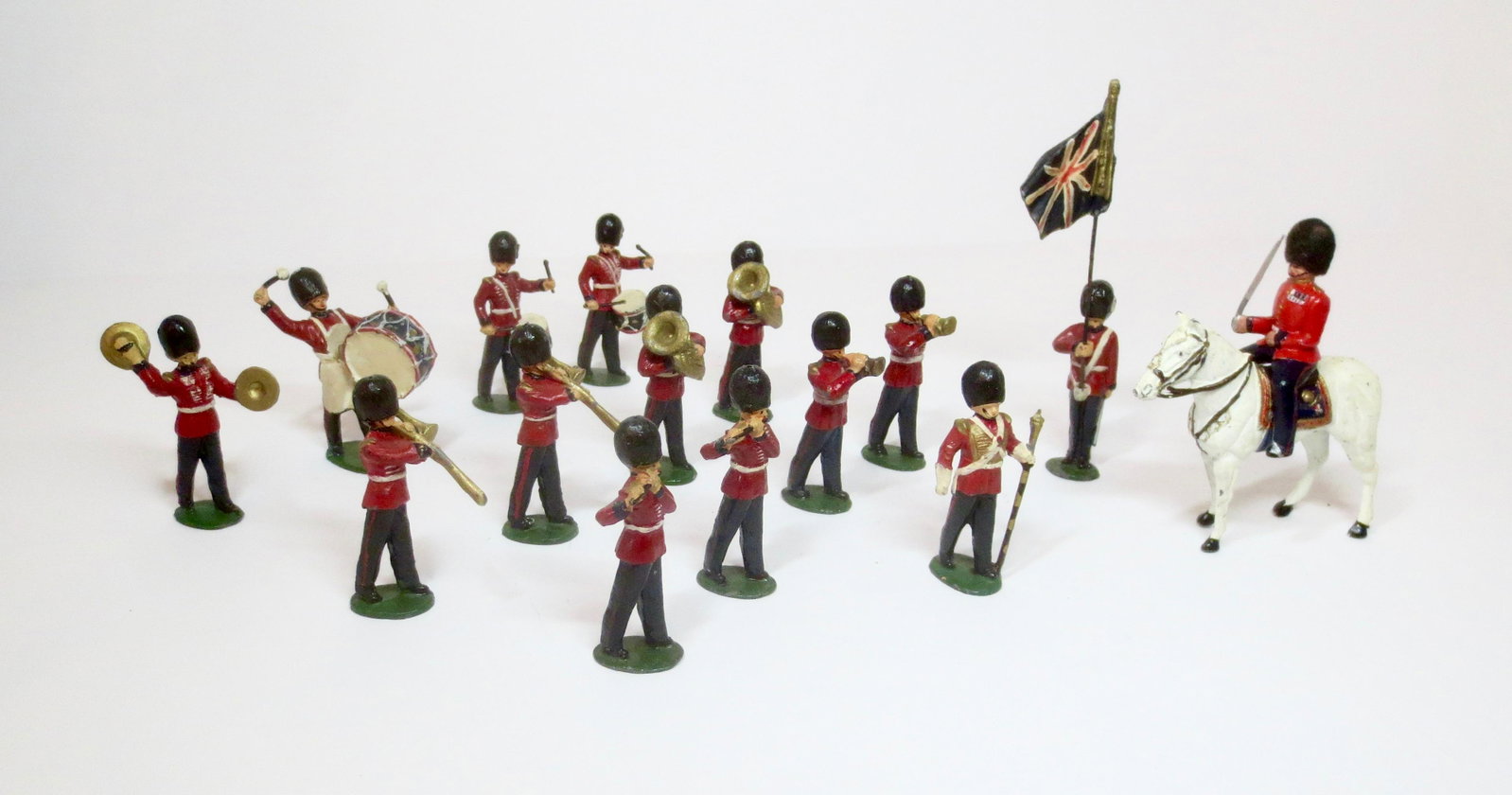 Timpo British Guards Band: Marching Band with Mounted Officer and Standard Bearer. 15 pieces. Near mint to excellent condition. Unboxed.