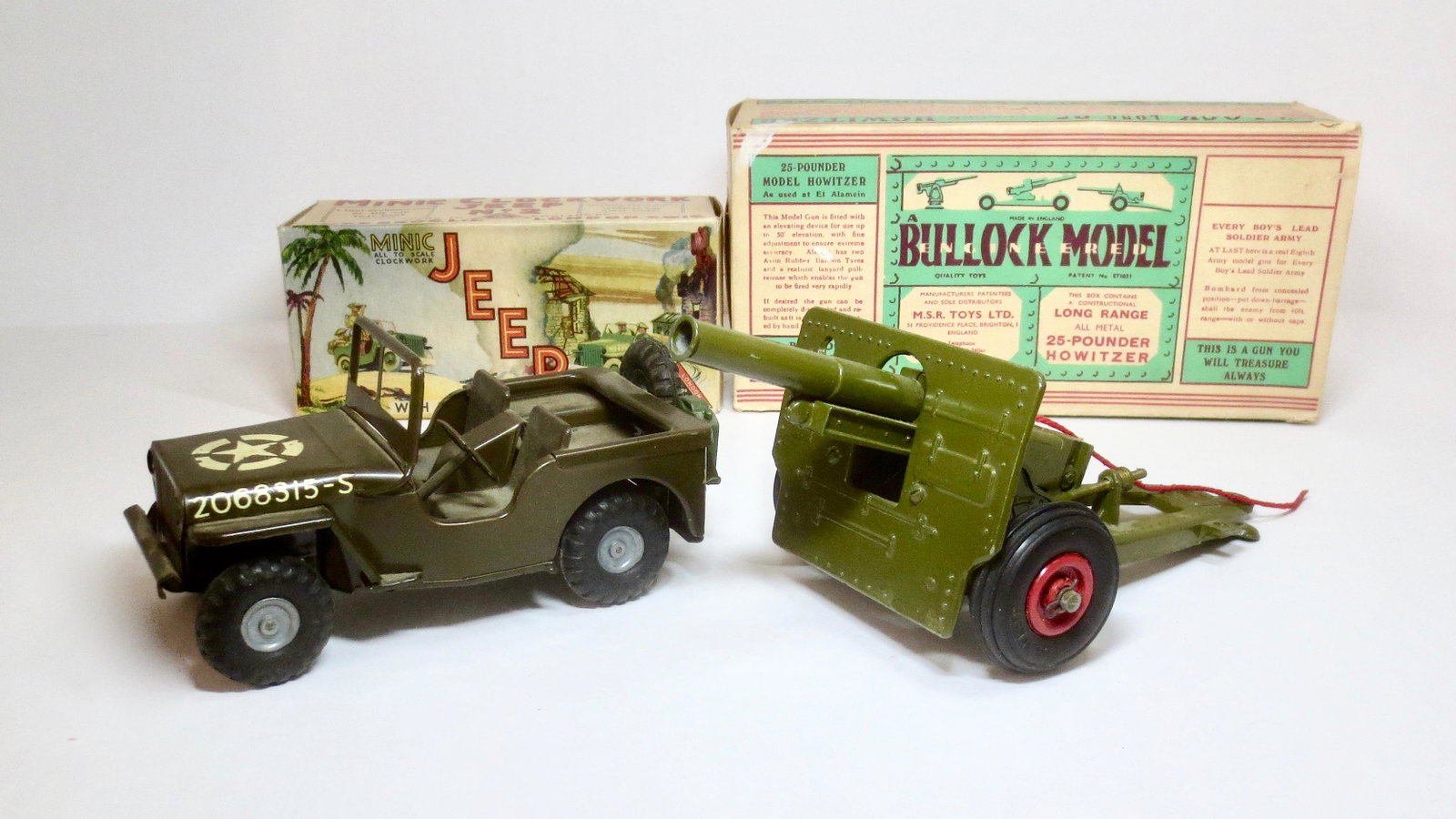 Triang Minic Jeep and Bullock 25 Pdr. Howitzer: Wind up Jeep is in good condition (key is missing, and wind up does not work). Howitzer is in excellent working condition. Boxes are excellent.