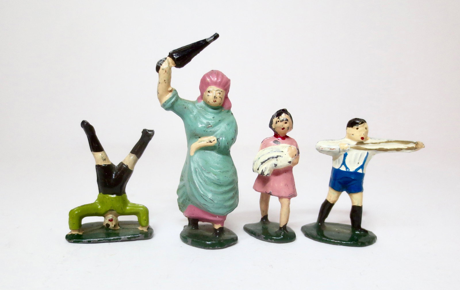 Phillip Segal Nursery Rhyme Figures: From "There was an Old Woman who lived in a Shoe" Rhyme. Two of her misbehaving children, and one minding a baby. Post war, circa mid 1950's. Missing the shoe house. 4 pieces. Excellent condition. Unb