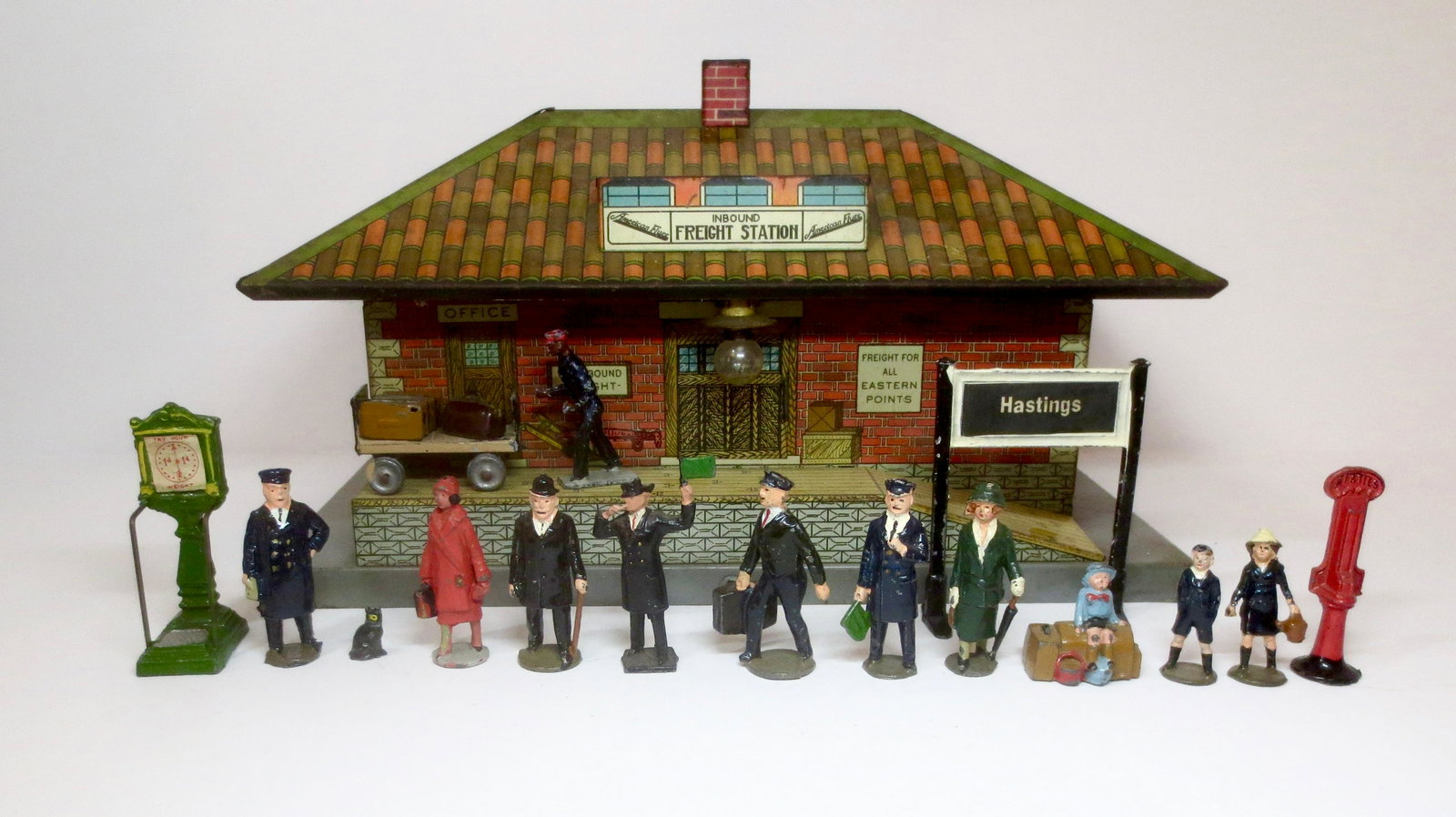 Johillco & Crescent Railway Figure Assortment: Fine collection of train figures & accessories. Comes with a tin freight station. 18 pieces. Excellent condition. Unboxed.