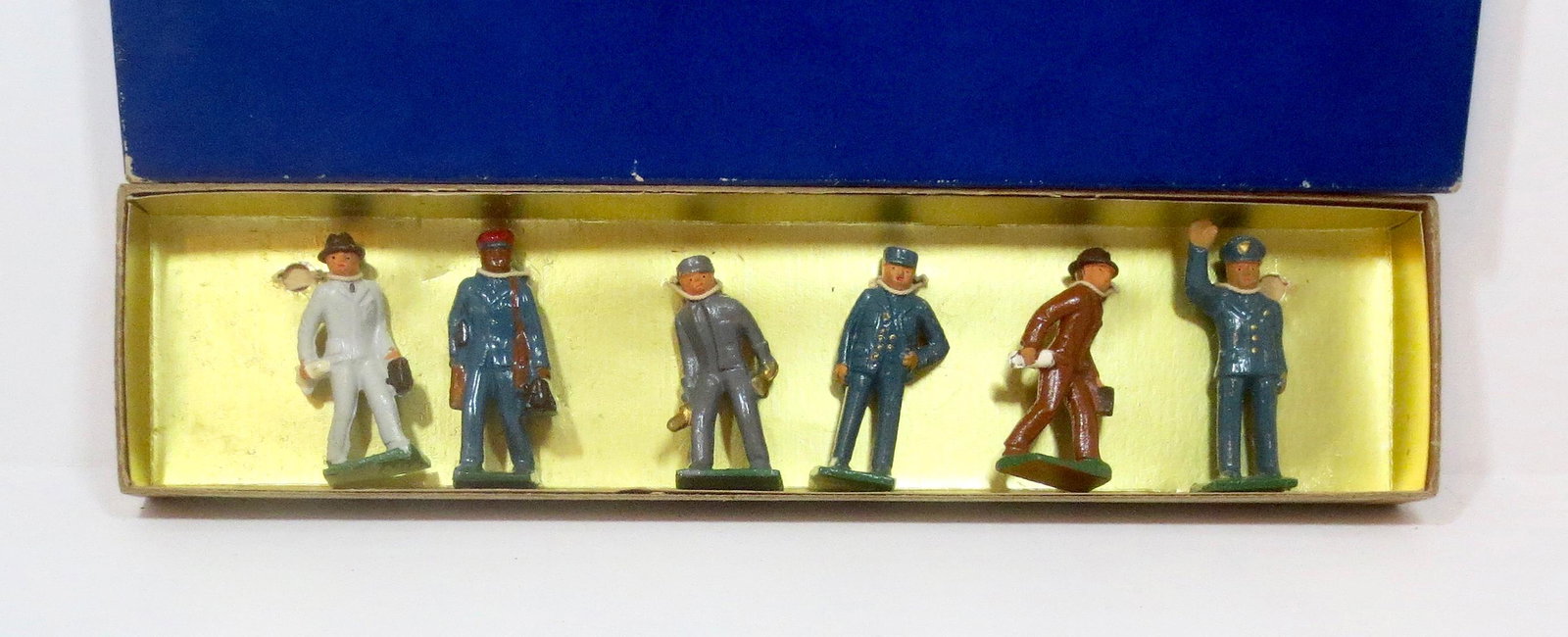 Grey Iron Train Figure Set: Train crew, Policeman, and Passengers. 2-1/4" tall. 6 pieces. Mint condition, tied to card in a plain blue box.